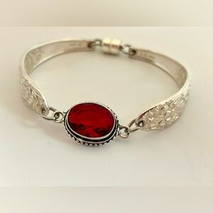 Elegant Silver Bracelet with Red Gemstone